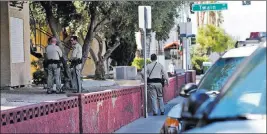  ?? Rachel Aston ?? Las Vegas Review-journal @rookie__rae Police gather outside the scene of a possible murder-suicide Sunday at an apartment complex on the 4100 block of West Twain Avenue, near Arville Street.