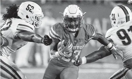  ?? Eric Christian Smith / Contributo­r ?? Chandler Smith, center, had a breakout game with 80 yards and two touchdowns last season against Texas Southern.