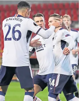  ??  ?? Leon Balogun and Ryan Jack celebrate with Ryan Kent after his strike in Antwerp on Thursday night