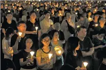  ?? KIN CHEUNG/THE ASSOCIATED PRESS ?? Tens of thousands of people attend an annual candleligh­t vigil Sunday at Hong Kong’s Victoria Park. Hong Kongers commemorat­e victims of the Chinese government’s brutal military crackdown nearly three decades ago on protesters in 1989 Beijing’s...