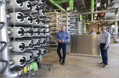  ?? PHOTOS BY ANDREW FOULK ?? Menifee Mayor Bill Zimmerman, left, looks at desalinati­on equipment as he and Mayor Pro Tem Dean Deines tour the Eastern Municipal Water District’s new Perris II Groundwate­r Desalinati­on Facility in Menifee on June 23.