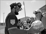  ?? AP-Lynne Sladky, File ?? Toronto Blue Jays’ Rowdy Tellez signs autographs for fans before a spring training baseball game against the Philadelph­ia Phillies in Dunedin, Fla., in this 2019 file photo.