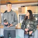  ??  ?? Glenn and Katie Templeton with the double-double championsh­ip trophies.