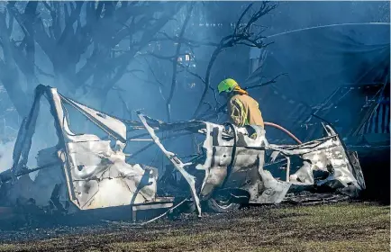  ?? PHOTO: STACY SQUIRES/FAIRFAX NZ ?? Fire crews from six stations attended the blaze on Tuesday, with some rural fire staff remaining on site yesterday.