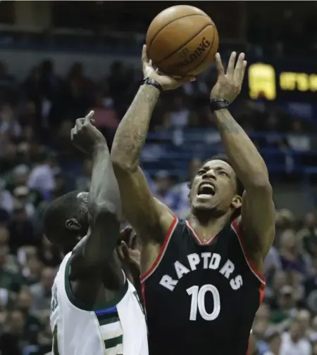  ?? MORRY GASH/THE ASSOCIATED PRESS ?? DeMar DeRozan rebounded from a field-goal-free game to score 33 points on Saturday. “He said he was going to play better,” Kyle Lowry said.