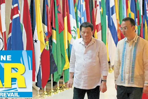  ?? KRIZJOHN ROSALES ?? President Duterte walks with Foreign Affairs Secretary Alan Peter Cayetano during the 120th anniversar­y of the Departmern­t of Foreign Affairs in Pasay City yesterday.