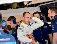  ?? AFP ?? Williams’ Polish driver Robert Kubica looks on in the pits during the first practice session. —