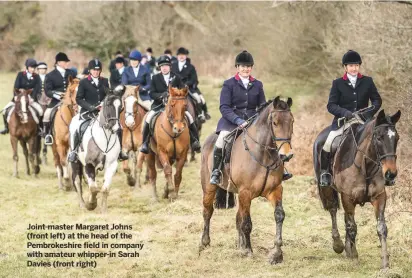  ??  ?? Joint-master Margaret Johns (front left) at the head of the Pembrokesh­ire field in company with amateur whipper-in Sarah Davies (front right)