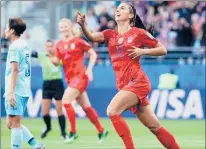  ?? ROBERT CIANFLONE/GETTY-AFP ?? Alex Morgan of the U.S. celebrates after scoring her team’s first goal during Tuesday’s match against Thailand in Reims, France.