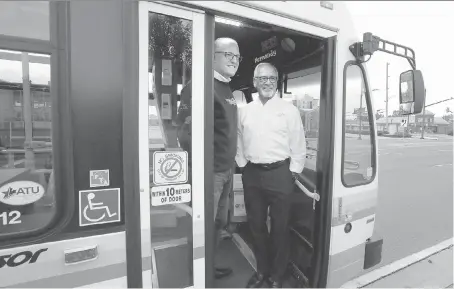  ?? JASON KRYK ?? Windsor Mayor Drew Dilkens, left, and LaSalle Mayor Ken Antaya board the first Transit Windsor bus dedicated to a new route between LaSalle and Windsor on Tuesday. The route 25 will operate between 7 a.m. and 7 p.m. Monday to Saturday.