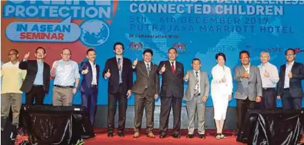  ?? BY MOHD FADLI HAMZAH
PIC ?? Deputy Communicat­ions and Multimedia Minister Datuk Seri Jailani Johari (sixth from right) in a group photo after officiatin­g the Child Online Protection In Asean seminar in Putrajaya yesterday.
