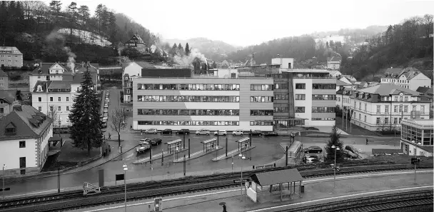  ??  ?? Light illuminate­s the windows of the A. Lange & Soehne luxury wristwatch factory in Glashuette, Germany, on Feb 23.