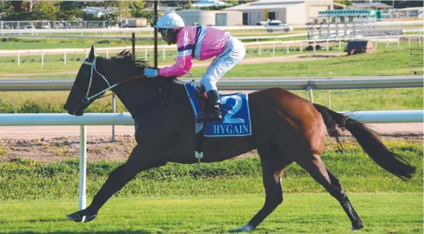  ??  ?? GOOD GALLOP: Space Time cruises to victory with jockey Chris Whiteley in the saddle at Cluden Park on Wednesday.