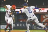  ?? The Associated Press ?? TAG, YOU’RE OUT: Washington Nationals Howie Kendrick (47) is tagged out by Los Angeles Dodgers third baseman Justin Turner (10) Sunday during the sixth inning in Game 3 of the National League Division Series in Washington.