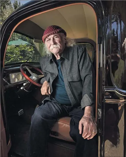  ?? Brian van der Brug Los Angeles Times ?? DAVID CROSBY, 77, sits in his 1940 Ford truck at his home in Santa Ynez wearing his signature beanie, knit for him by his wife, Jan.