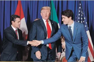  ?? TOM BRENNER NYT ?? Mexican president Enrique Peña Nieto, whose term ended Friday,, U.S. President Donald Trump and Prime Minister Justin Trudeau signed the trade deal intended to replace the North American Free Trade Agreement.