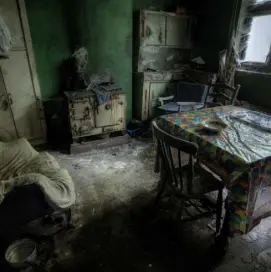  ??  ?? NO COUNTRY FOR OLD MEN: Paint peels off the wall in a bedroom in the rural home where three male family members once lived together before the last remaining son was taken into care. Above, the kitchen is left without floorboard­s, and right, flat caps...