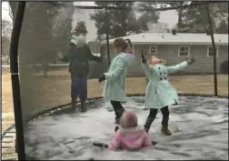  ?? Special to the MDR ?? Ilana Basham, Laynie Basham, Hayden Johnson and Harper Johnson play on a trampoline.