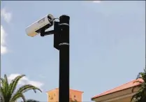  ?? STAFF FILE ?? Wellington is working with the Palm Beach County Sheriff’s Office to install cameras, like this one in Manalapan, for a license-plate tracking system at key intersecti­ons. The number of vehicles stolen in Wellington went up 20 percent from 74 in 2016...