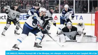  ??  ?? LOS ANGELES: Mathieu Perreault #85 of the Winnipeg Jets attempts a shot in front of Jack Campbell #36 of the Los Angeles Kings during the third period in a 2-1 Kings win at Staples Center in Los Angeles, California. — AFP