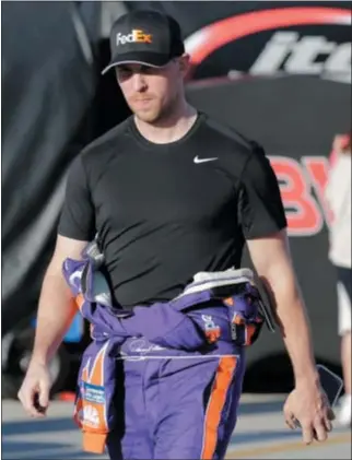  ?? (AP PHOTO/TERRY RENNA) ?? Denny Hamlin walks to his garage during a practice session for the Clash NASCAR auto race at Daytona Internatio­nal Speedway, Friday, Feb. 17, 2017, in Daytona Beach, Fla.