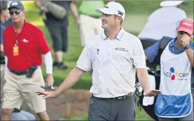  ?? DAVID BECKER — THE ASSOCIATED PRESS ?? Jason Kokrak walks off the 18th hole after completing the final round of the CJ Cup tournament Sunday. He won by two strokes for his first PGA Tour victory in 233starts.