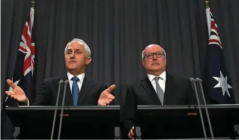  ?? PHOTO: SAM MOOY/AAP ?? PUSHING THEIR CASE: Australian Prime Minister Malcolm Turnbull and Attorney-General George Brandis hold a joint media conference yesterday about rejigging the Racial Discrimina­tion Act.