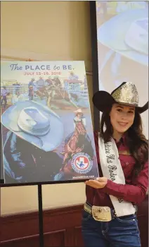  ?? NEWS PHOTO PEGGY REVELL ?? Medicine Hat Exhibition & Stampede princess Ava Padfield helps to unveil this year's official poster and slogan Tuesday.