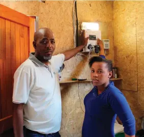  ?? Photo: Supplied ?? White Location resident Azola Sikontya (right) was the beneficiar­y of an electricit­y connection after losing her home in the June fires. With her is Knysna Ward 4 councillor Velile Waxa.