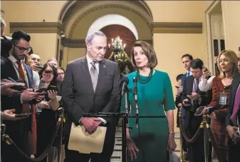  ?? Sarah Silbiger / New York Times ?? Senate Minority Leader Sen. Chuck Schumer of New York and House Minority Leader Nancy Pelosi of California discuss the plan with reporters outside the House chambers.