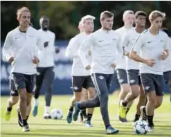  ?? — AFP ?? LEIPZIG: Leipzig’s German forward Timo Werner (C) attends a training session on the eve of the UEFA Champions League football match between RB Leipzig and AS Monaco in Leipzig, eastern Germany yesterday.