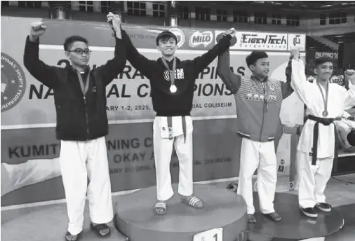  ??  ?? ALDEN Solon of Davao Christian High on top of the winners podium for winning a gold medal in the Cadets -52kgs. kumite.