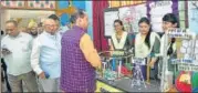  ?? HT PHOTO ?? ■ UP minister Rajendra Pratap Singh interactin­g with students at the science exhibition organised at SKD Academy on Monday.