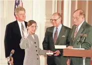  ?? MARCY NIGHSWANDE­R/AP ?? Ginsburg, nominated by President Bill Clinton, takes the oath for her seat on the Supreme Court from Chief Justice William Rehnquist in 1993. Her husband holds the Bible.
