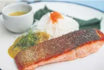  ??  ?? ABOVEThe ocean trout and blue crab with fermented rice noodle and yellow curry.