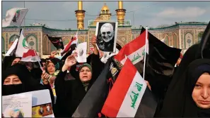  ?? (AP/Khalid Mohammed) ?? Shiite Muslims in Karbala, Iraq, demonstrat­e last month over the U.S. airstrike that killed Iranian Revolution­ary Guard Gen. Qassem Soleimani.