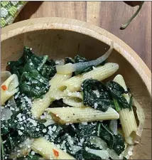  ?? PHOTO BY CATHY THOMAS ?? In this simple dish, wilted greens combine with pasta and get a kick from onion, garlic and a red chile or chile flakes.