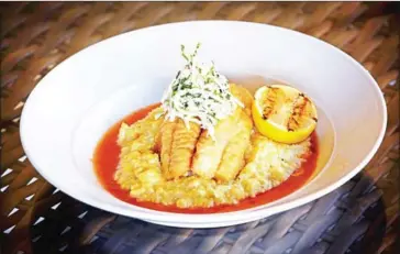  ?? DEB LINDSEY/THE WASHINGTON POST ?? Cornmeal-crusted blue catfish at Red’s Table in Reston, Virginia. Chefs have been pushing the fish as part of an effort to control its burgeoning population in the Chesapeake Bay.