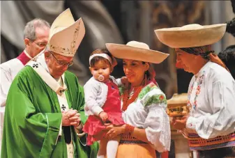  ?? Vincenzo Pinto / AFP / Getty Images ?? Pope Francis leads a Mass marking the World Day of Migrants and Refugees at St Peter’s Basilica in the Vatican. Several thousand immigrants from 49 countries attended the service.