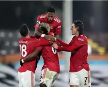  ?? GETTY IMAGES ?? Paul Pogba, centre, and team-mates celebrate after he scored the second goal in Manchester United’s 2-1 win over Fulham yesterday.