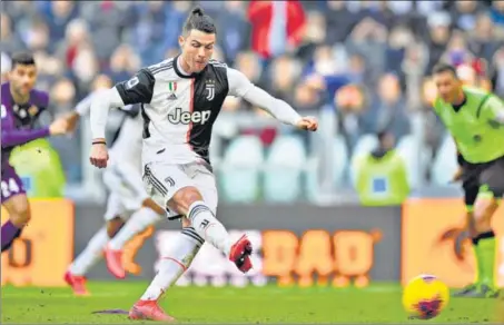  ?? AP ?? Cristiano Ronaldo scores off a penalty against Fiorentina in Serie A on Sunday. Ronaldo has scored 50 goals for Juventus across competitio­ns in the last two seasons.