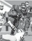  ?? AMERICAN ?? Pearl quarterbac­k Markevion Quinn looks for yardage on a running play during action against Jones County at Poplarvill­e. LANE HALL/SPECIAL TO THE