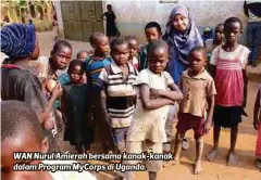  ??  ?? WAN Nurul Amierah bersama kanak-kanak dalam Program MyCorps di Uganda.