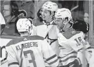  ?? Jeff Mcintosh / Associated Press ?? After a 41-goal season, Stars winger Jason Robertson, center, has managed one assist on a goal by Joe Pavelski, right, during the series against the Flames.