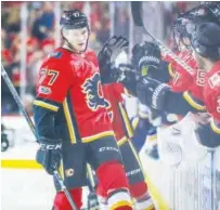  ?? Reuters ?? Calgary Flames’ Mark Jankowski (77) celebrates with team-mates after scoring a goal against the St Louis Blues during their NHL game on Monday.