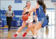  ?? MICHAEL COOPER / CONTRIBUTE­D ?? Waynesvill­e junior Isabella Cassoni drives past Mariemont’s Kendall Spreen Saturday afternoon at Springfiel­d High School. Cassoni scored 21 points as the Spartans won 33-29.