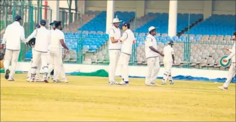  ?? HT ?? ▪ Uttar Pradesh team members celebrate an Assam wicket on the opening day of their Ranji Trophy match in Kanpur on Monday.