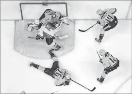  ??  ?? Nashville Predators goalie Pekka Rinne (35) blocks a shot by Anaheim Ducks right wing Corey Perry (10) during the second period in Game 4 on Thursday in Nashville, Tenn. Also defending for the Predators are P.K. Subban (76), Mike Fisher (12) and...