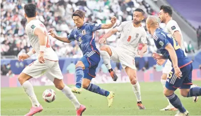  ?? — AFP photo ?? Japan’s midfielder Hidemasa Morita scores his team’s first goal during the Qatar 2023 AFC Asian Cup quarter-final football match between Iran and Japan.