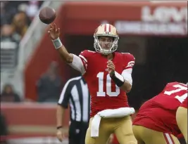  ?? NHAT V. MEYER — BAY AREA NEWS GROUP ?? San Francisco 49ers' Jimmy Garoppolo (10) throws against the Seattle Seahawks in the third quarter at Levi's Stadium in Santa Clara on Sept. 18, 2022.